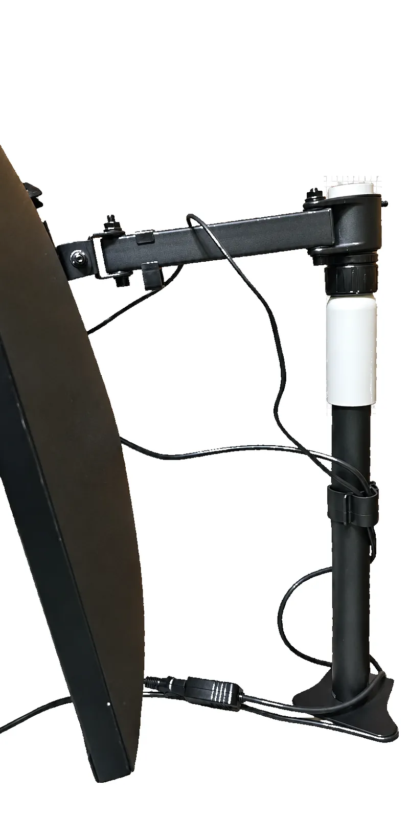 The monitor arm's collar mounted on the white extension, holding the monitor higher on the stand